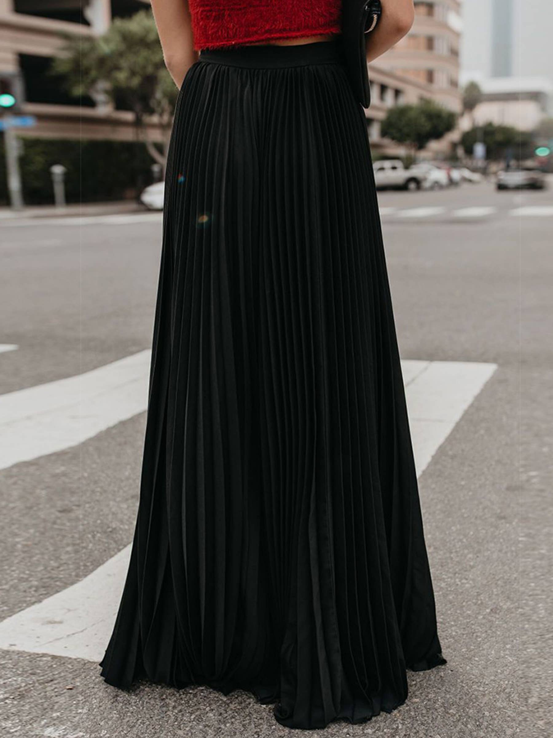Green solid color long pleated dressy skirt by wholesalesir, featuring a stylish, elegant design and a comfortable fit.