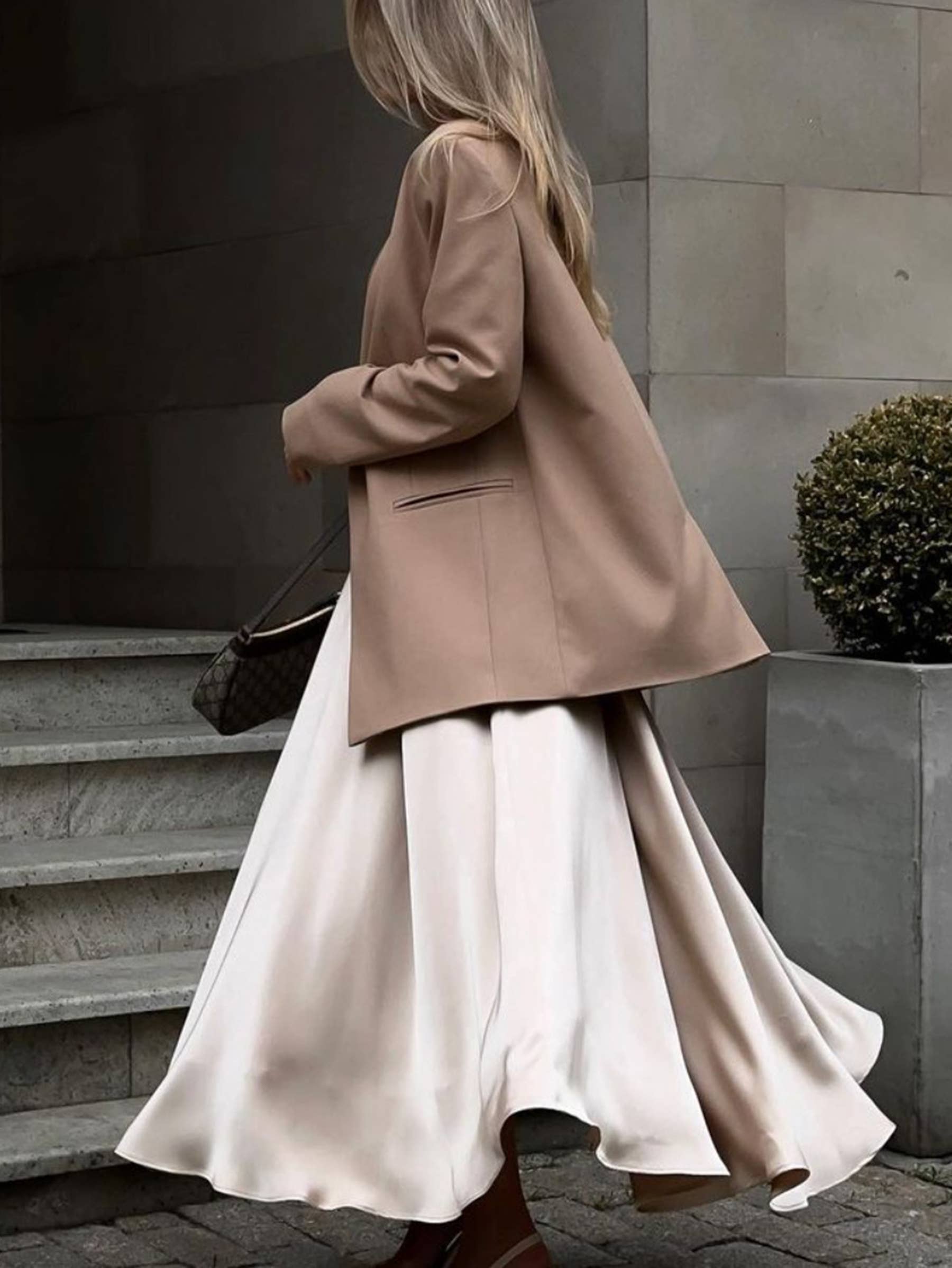 Beige high-waisted long dressy skirt from wholesalesir, featuring elegant and sophisticated style with smooth fabric and tailored fit.
