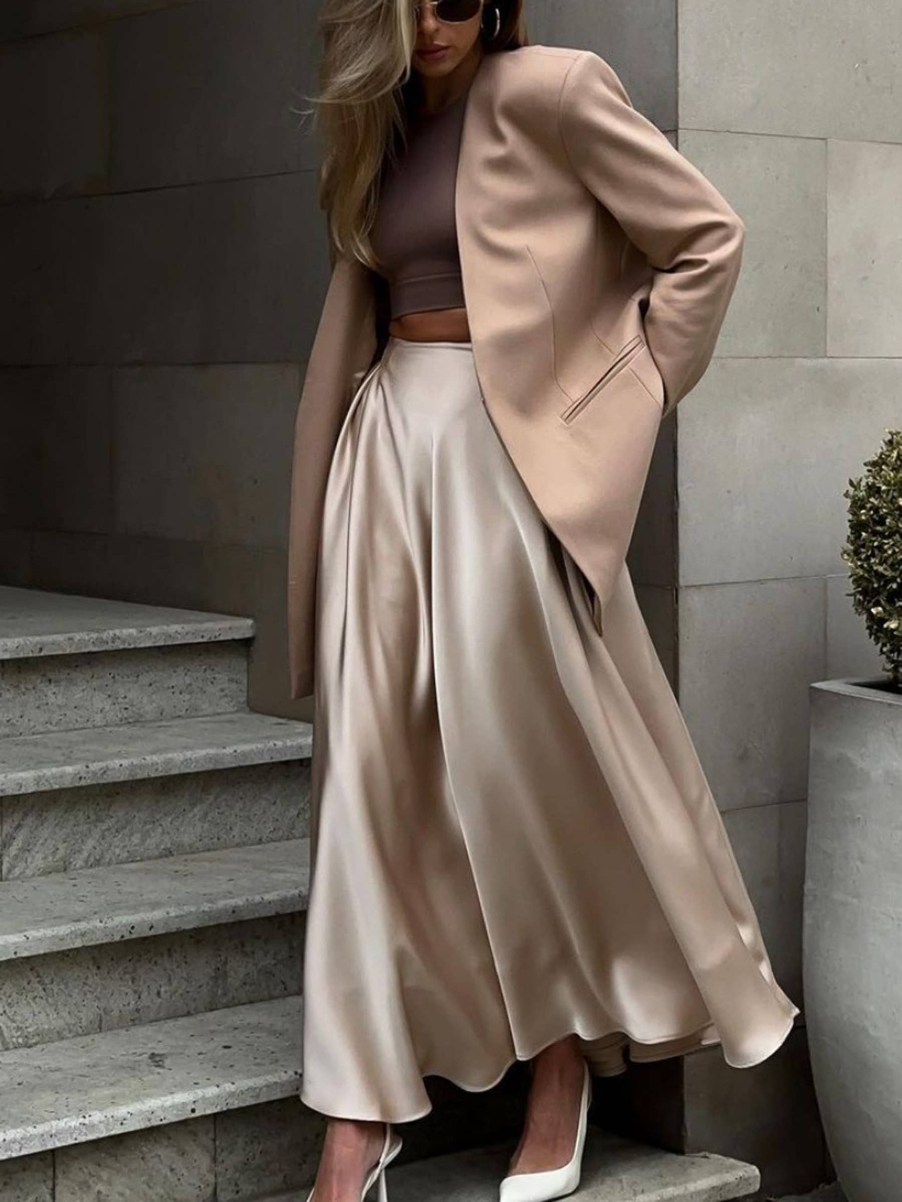 Beige high-waisted long dressy skirt by Wholesalesir, elegant and flowy with a sophisticated design perfect for formal occasions.