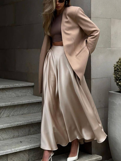 Beige high-waisted long dressy skirt by Wholesalesir, elegant and flowy with a sophisticated design perfect for formal occasions.