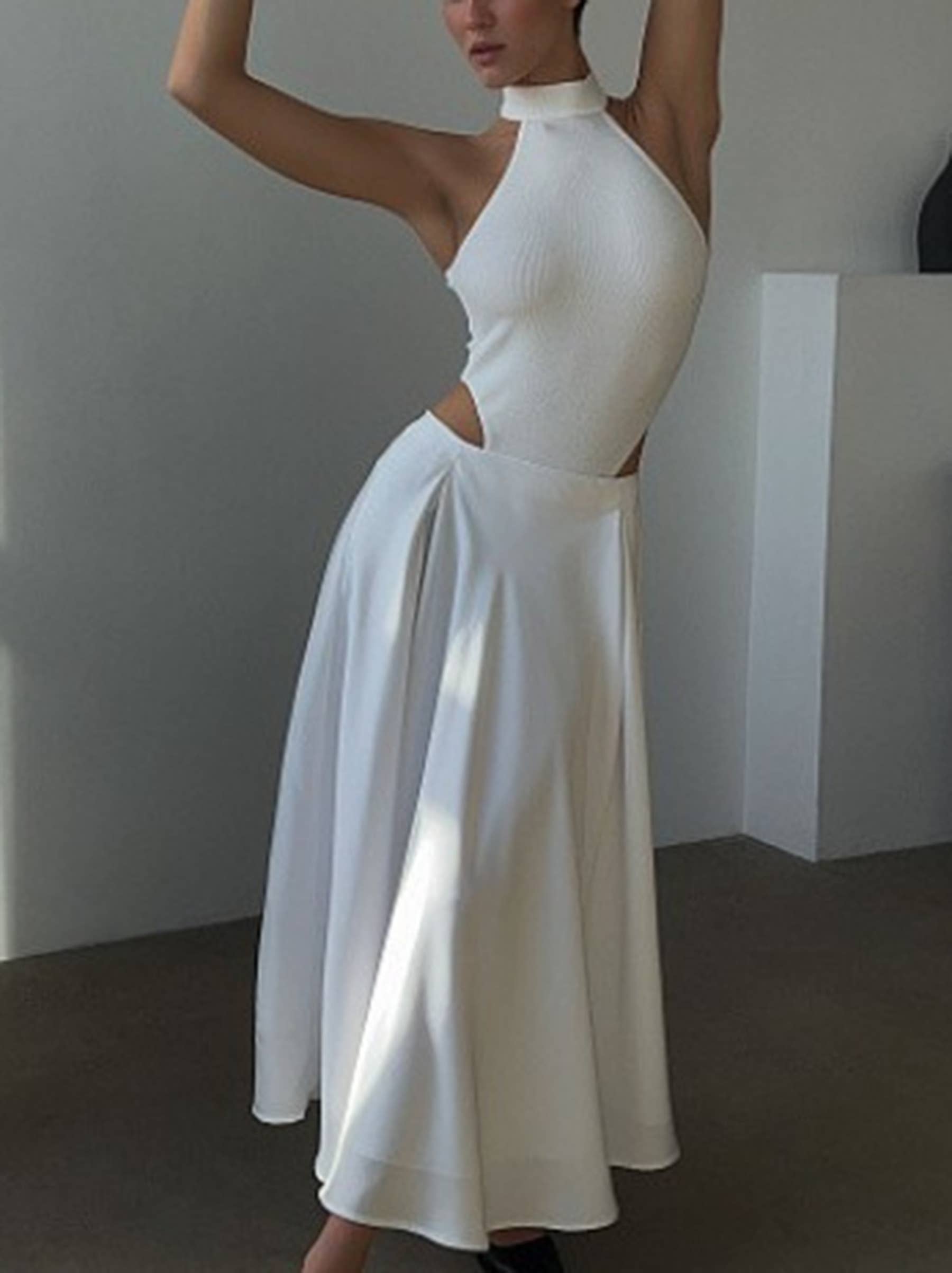 Beige high-waisted long dressy skirt by wholesalesir, elegant and flowing with a sophisticated design.