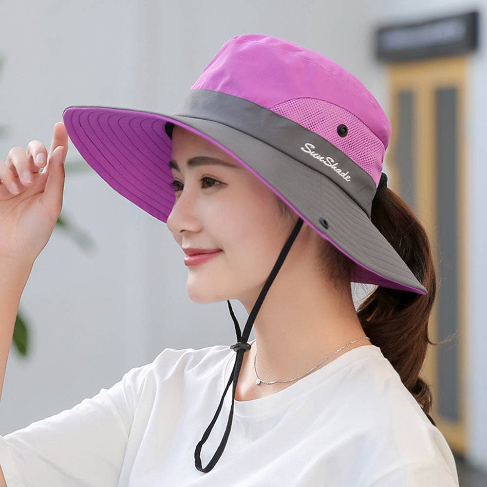 Pink women's UV protection hat with a foldable wide brim and ponytail opening, by wholesalesir.