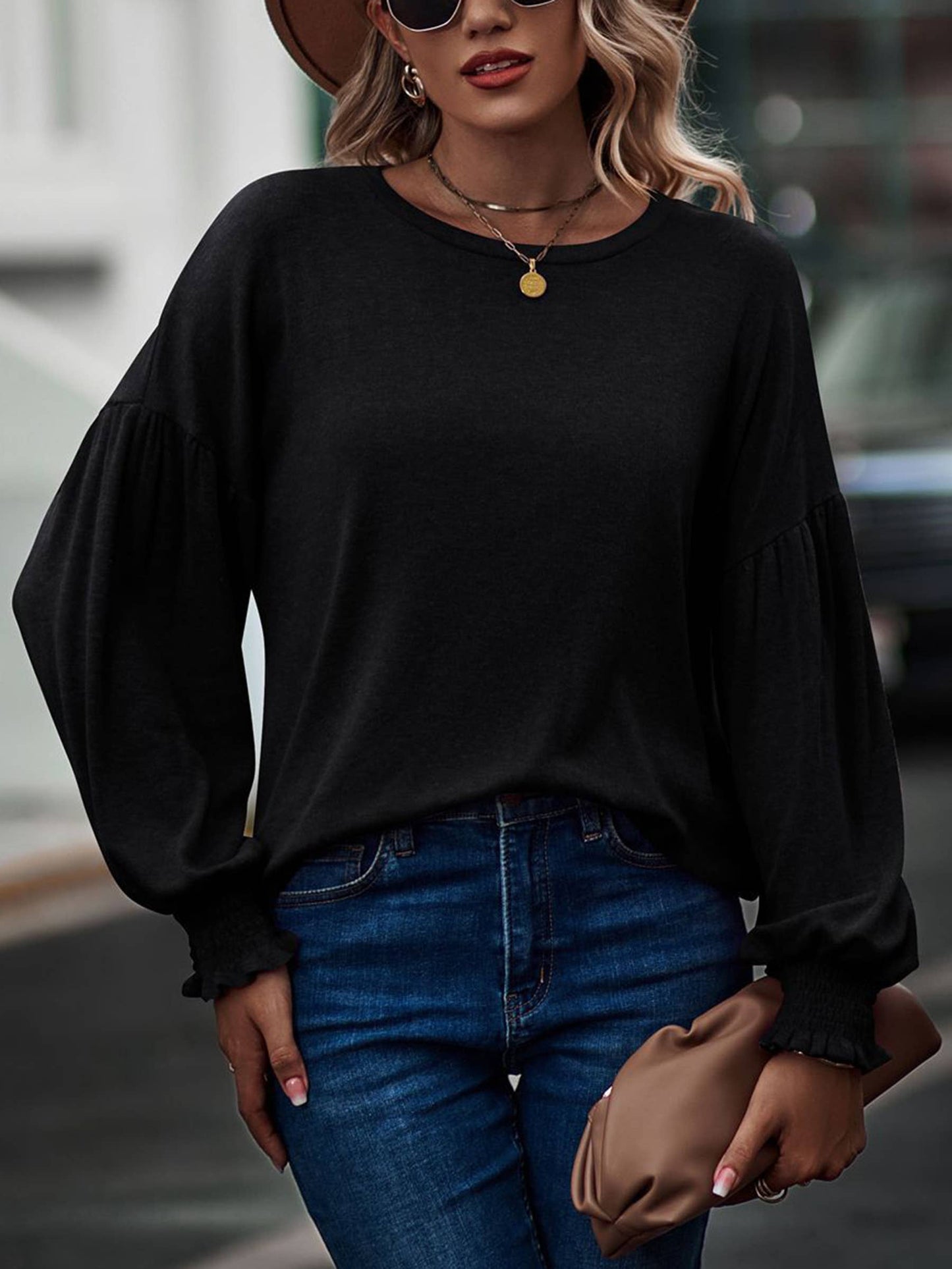 Purple women's long sleeve top with round neck, pleated details, and lantern sleeves from wholesalesir.