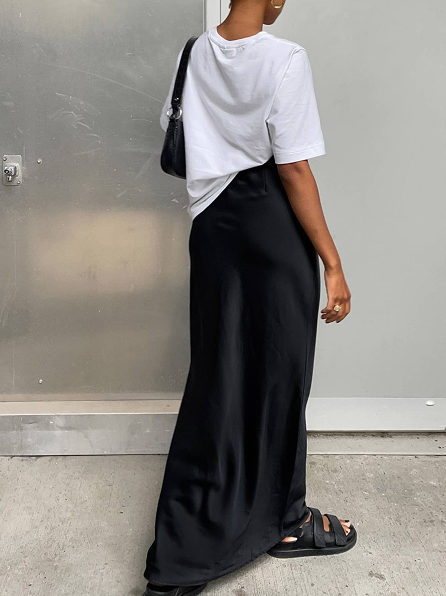 Black satin maxi skirt for women with a fishtail design, ideal for commuting, by wholesalesir.