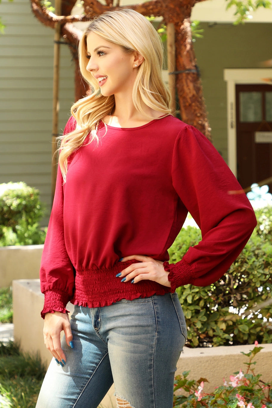Beige You & Me smocked hem long sleeve woven top with a dressy style and solid design, featuring a comfortable fit and stylish details.