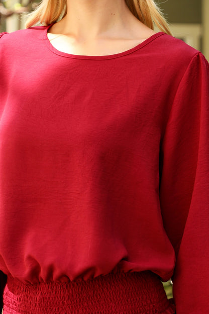 Beige You & Me smocked hem long sleeve woven dressy top with a stylish, solid design and elegant fit.