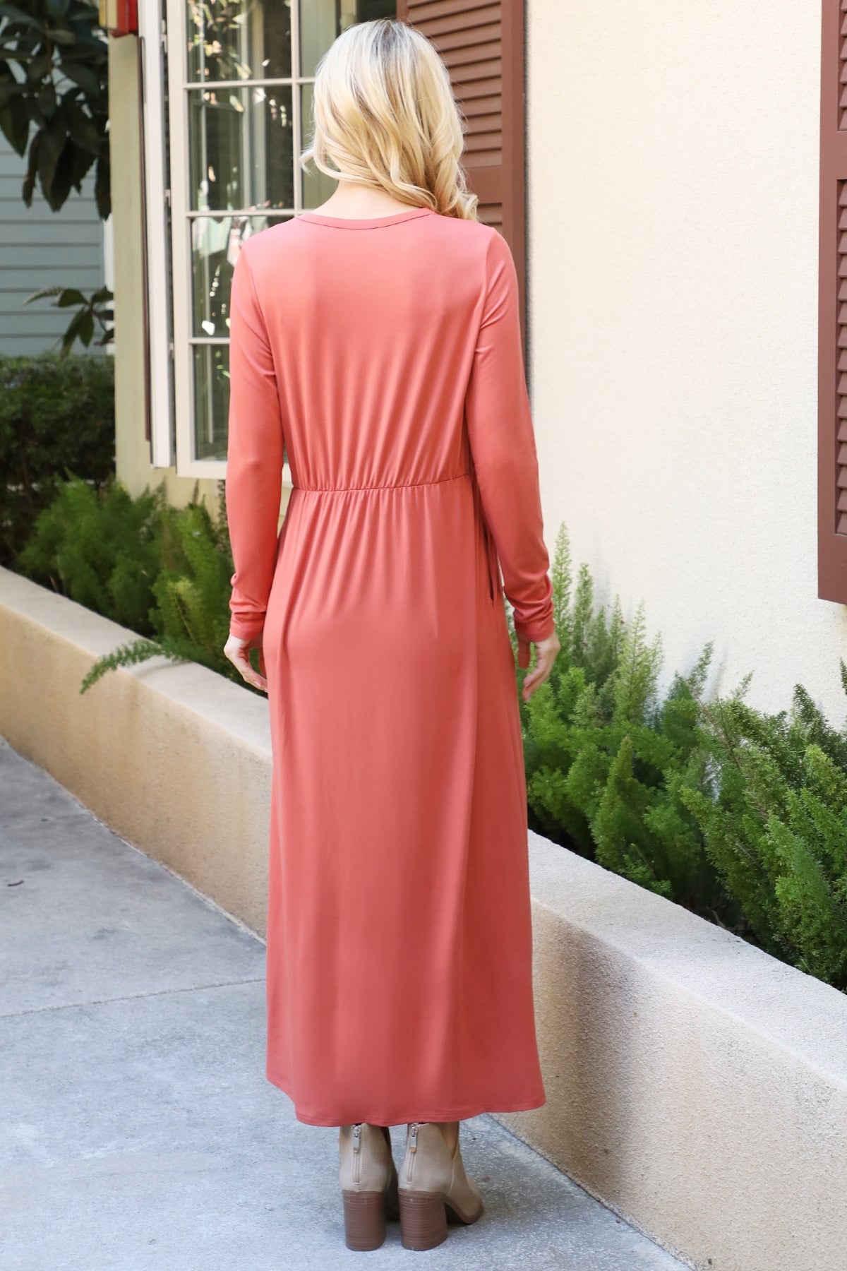 You & Me solid terracotta maxi dress with long sleeves and elastic waist, featuring a flowing silhouette and elegant design.