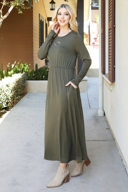 You & Me solid terracotta maxi dress with long sleeves and elastic waist, flowing and elegant for casual or special occasions.