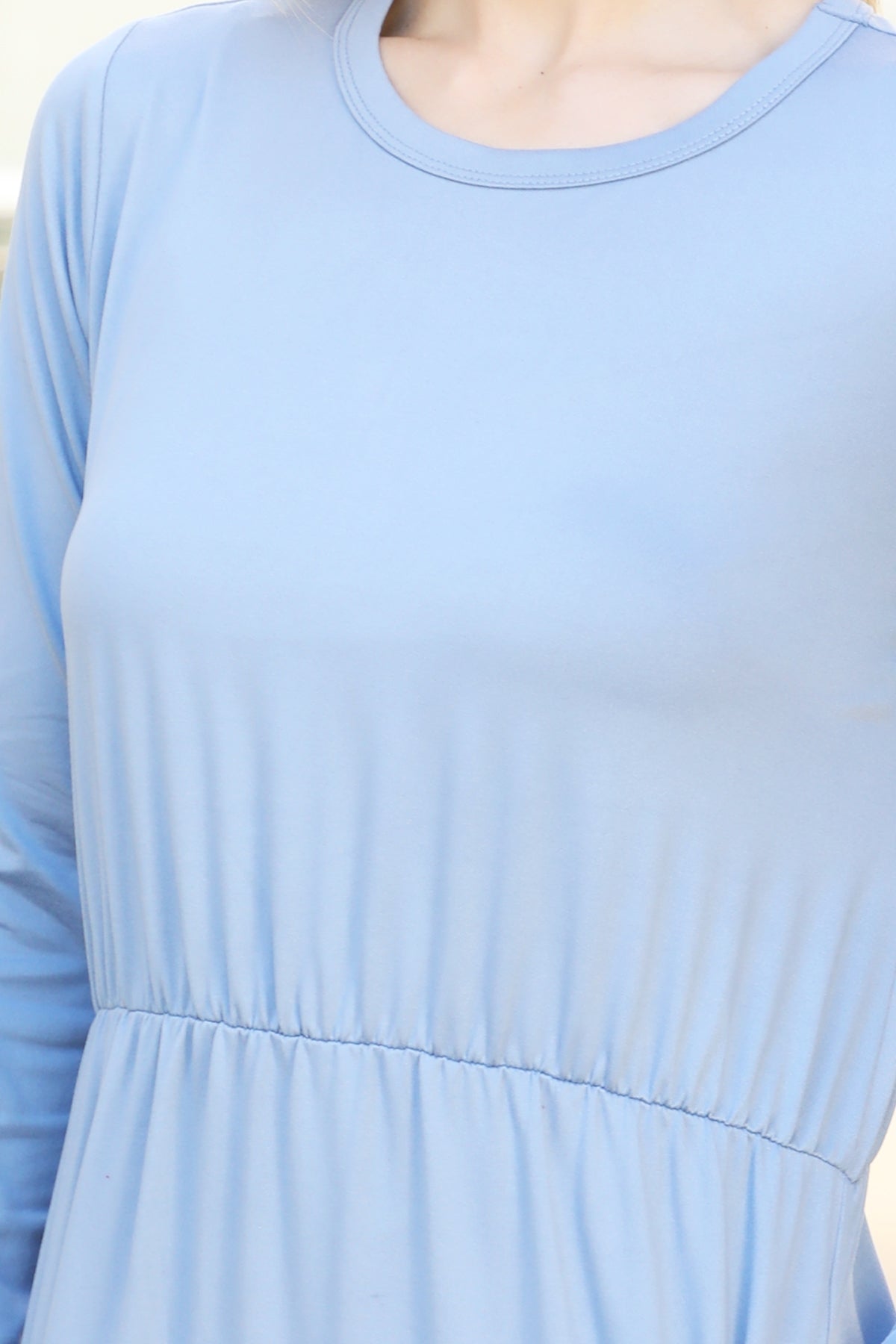 You & Me solid terracotta maxi dress with long sleeves and elastic waist, showcasing a flowing, elegant design.