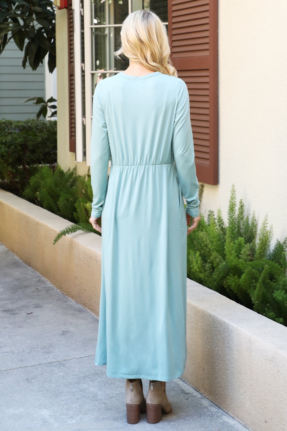 You & Me solid terracotta maxi dress with long sleeves and elastic waist, featuring a flowing silhouette and elegant design.