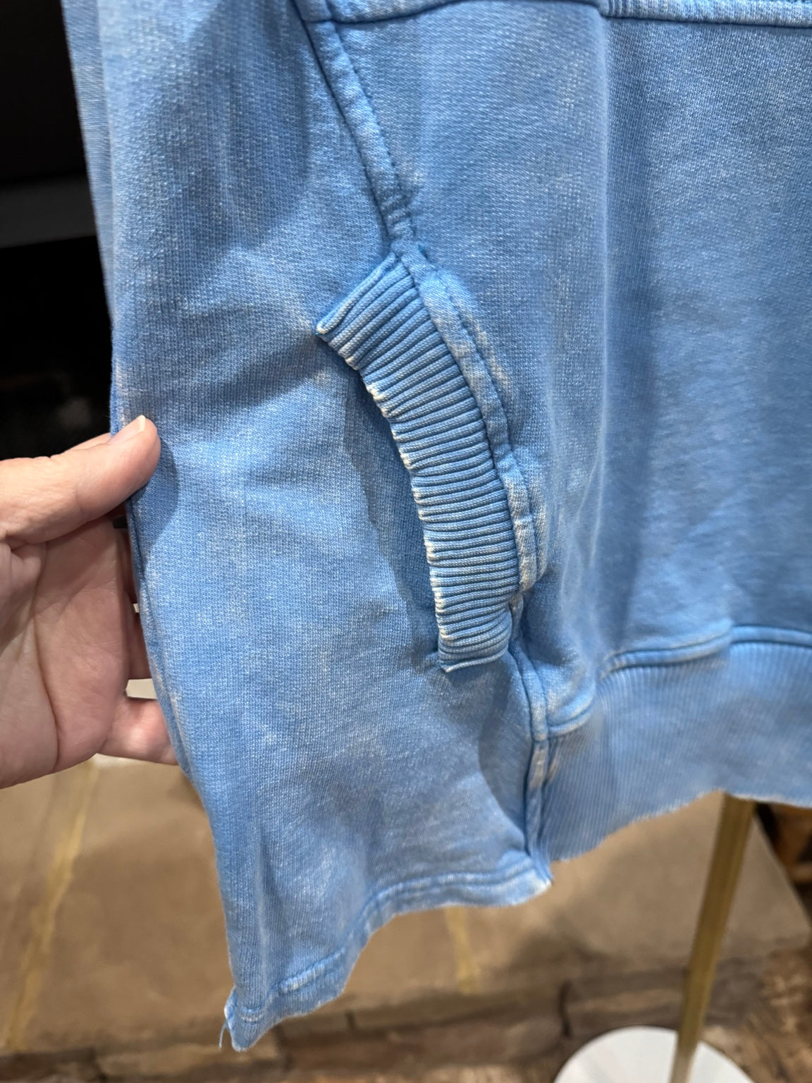 Rib-trimmed kangaroo pocket and distressed mineral wash detail