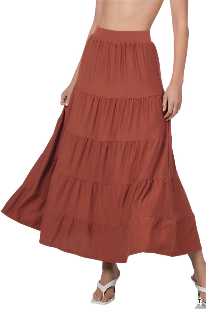 Black elastic waist tiered ruffle maxi skirt by Zenana, featuring flowing fabric and a layered design for a stylish look.