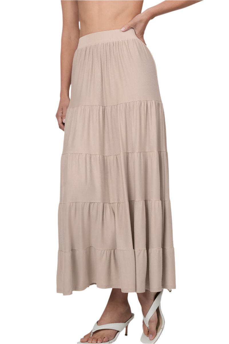 Black Zenana elastic waist tiered ruffle maxi skirt, showing its flowy fabric and layered ruffle design in a close-up image.