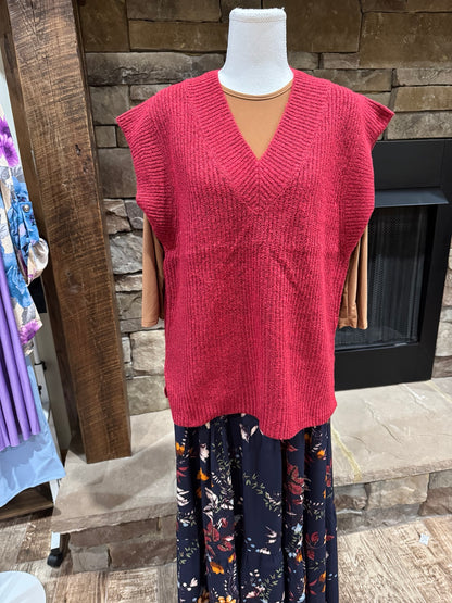 Zenana heathered red V-neck sweater vest with ribbed trim, styled over a long-sleeve top