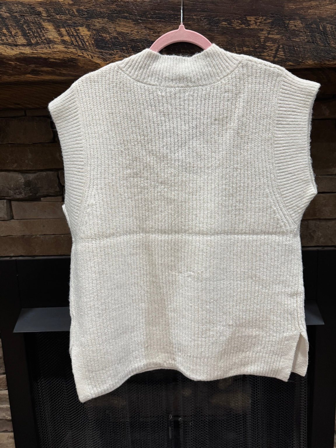 Back of Zenana solid ivory sweater vest showing ribbed hem and side slits