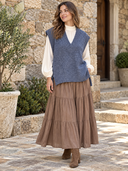 Woman wearing Zenana heathered navy sweater vest over a cream long-sleeve blouse with a taupe maxi skirt