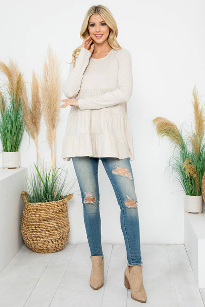 Cream-colored solid long sleeve tiered top by Perfect Peach, featuring a relaxed fit and layered design.
