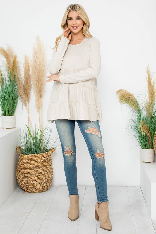 Cream-colored solid long sleeve tiered top by Perfect Peach, featuring a relaxed fit and layered design.