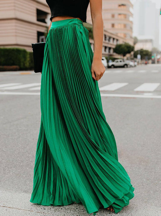 Green solid color long pleated dressy skirt by wholesalesir, featuring a stylish, elegant design with a flattering fit.