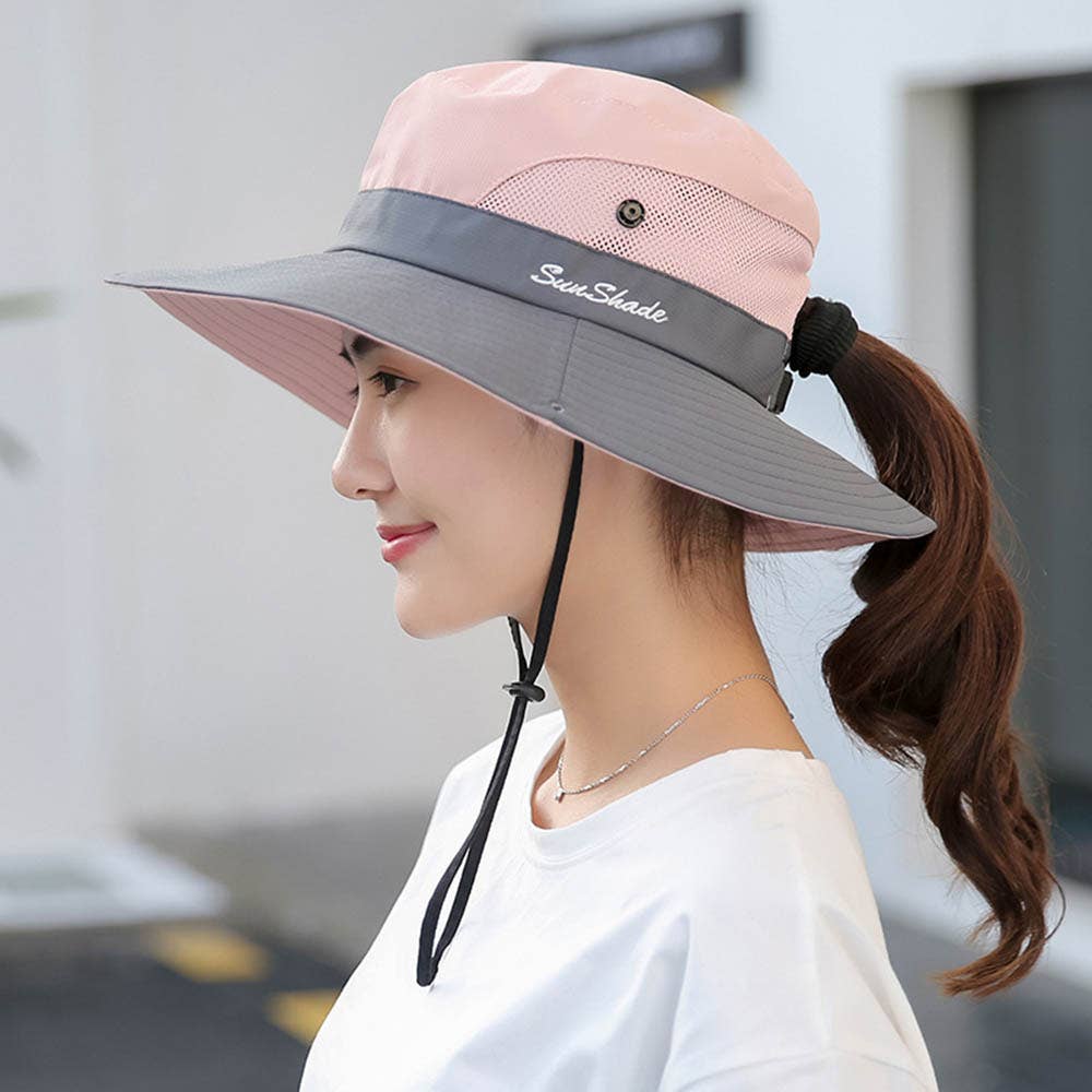 Women's pink UV protection hat with foldable wide brim and ponytail opening, by wholesalesir.