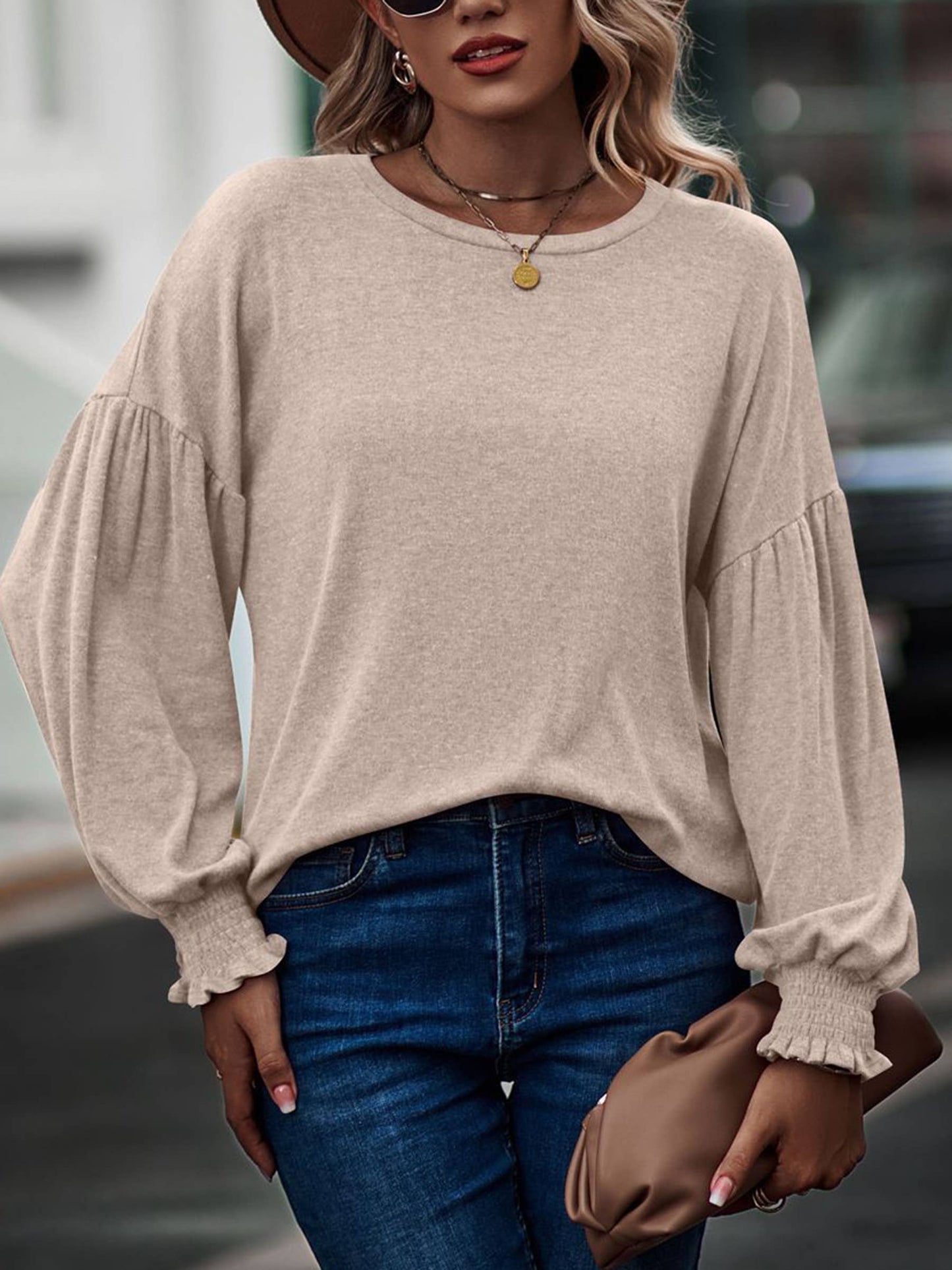 Beige women's long sleeve top with round neck, pleated lantern sleeves, from wholesalesir, stylish and comfortable for everyday wear.